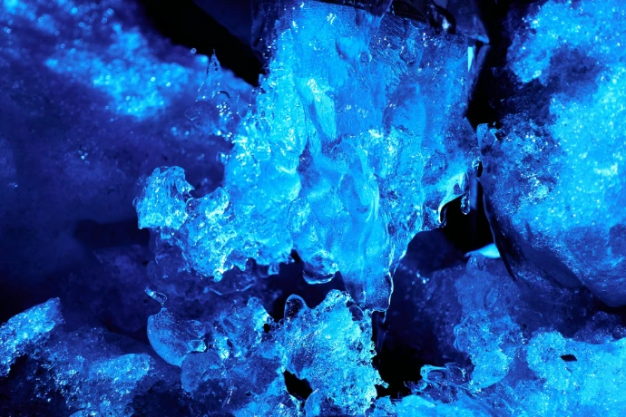 a close up of a blue substance of ice